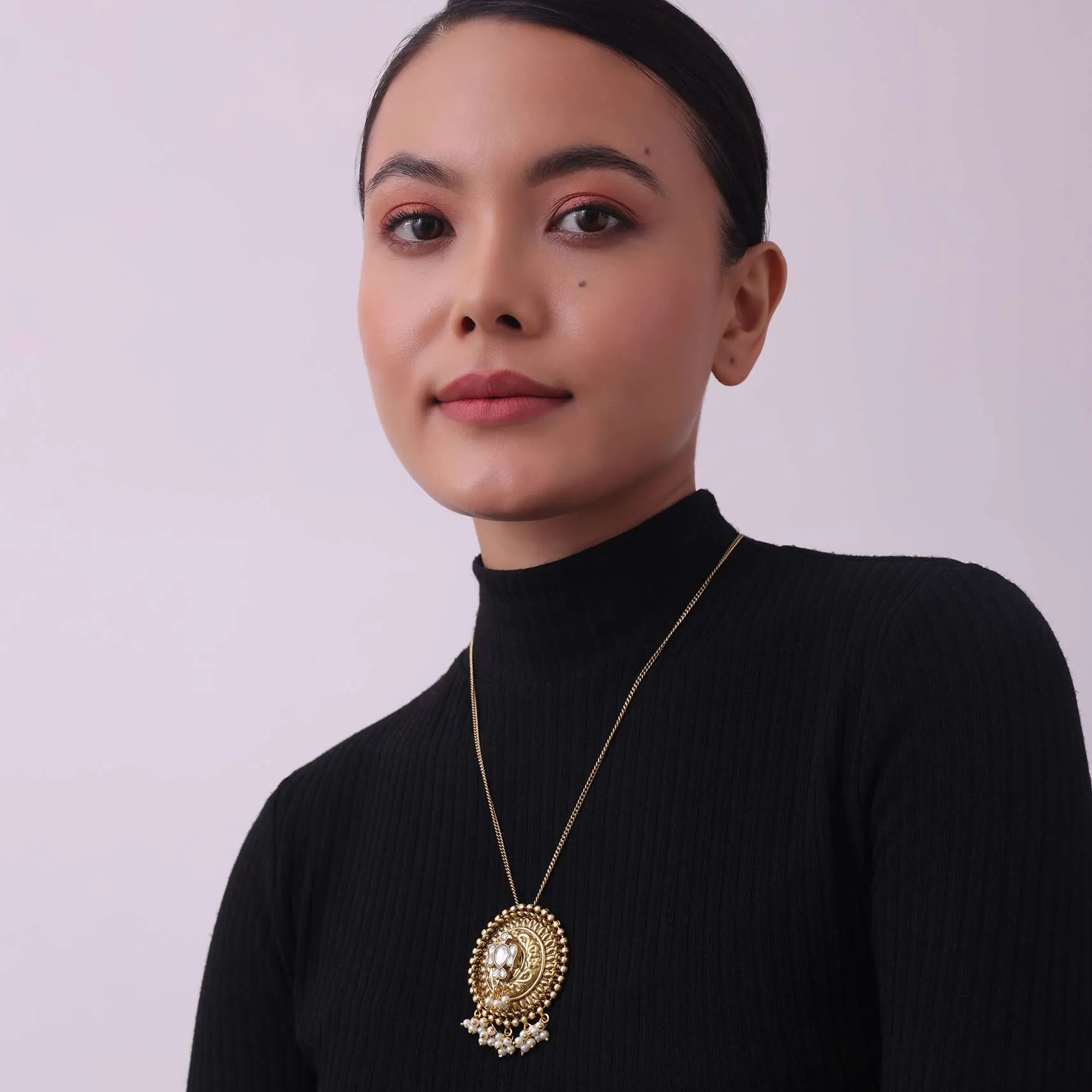 Gold Finish Long Necklace Embedded With A Small Motif